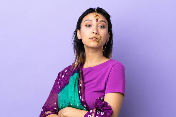 Indian woman isolated on purple background - Foto, Imagen