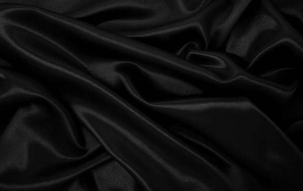 Smooth elegant black silk or satin luxury cloth texture can use as abstract background. Luxurious background design - Fotoğraf, Görsel