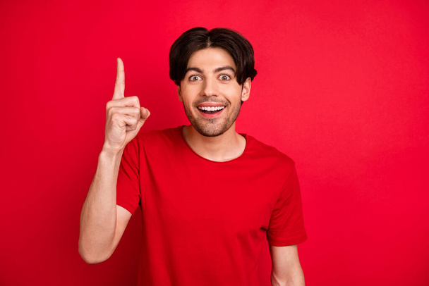 Photo of smart creative guy rise finger have great idea excited face wear red t-shirt isolated red color background - Φωτογραφία, εικόνα
