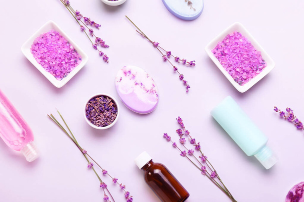 Composition with cosmetic products, sea salt and lavender flowers on white background - Foto, Imagen