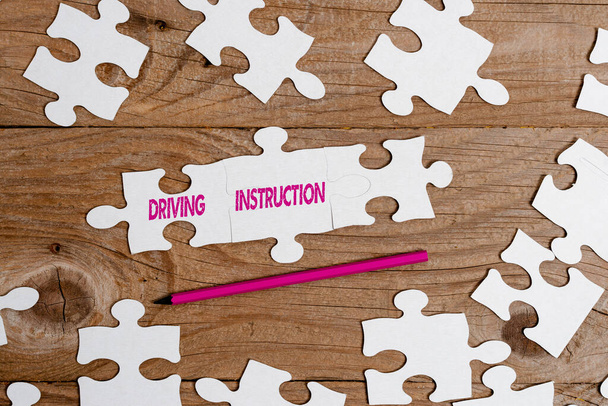 Text sign showing Driving Instruction. Internet Concept detailed information on how driving should be done Building An Unfinished White Jigsaw Pattern Puzzle With Missing Last Piece - Photo, Image