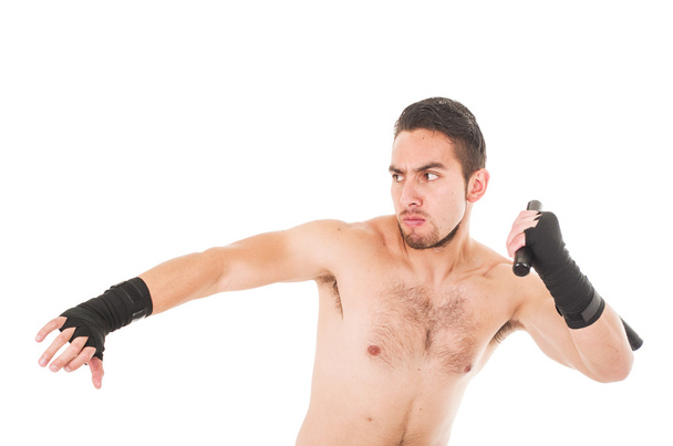 tough martial arts fighter wearing black shorts and wristband - Photo, image