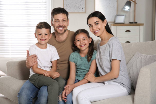 Portrait of happy family in living room. Adoption concept - Foto, Imagem