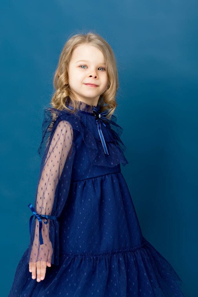 Portrait charming little girl in nice blue dress - Photo, image