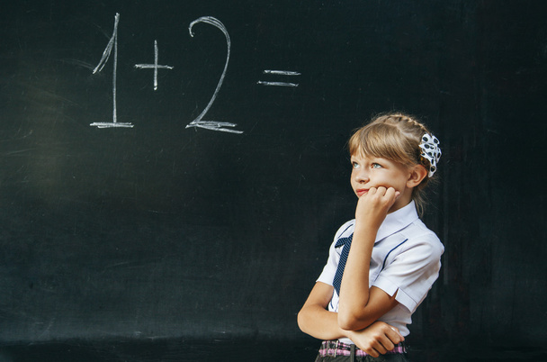 Happy school girl on math classes finding solution and solving problems - Φωτογραφία, εικόνα