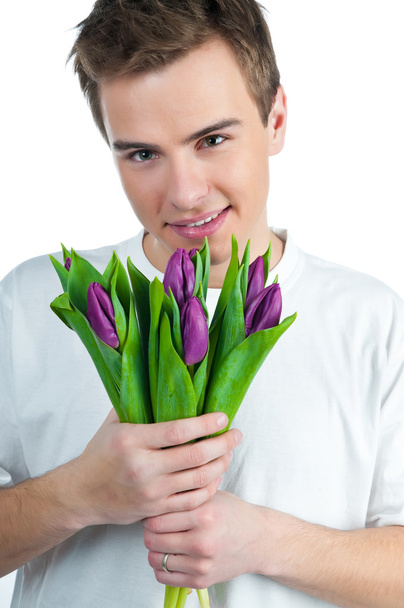 Man with a bouquet of tulips - Fotoğraf, Görsel