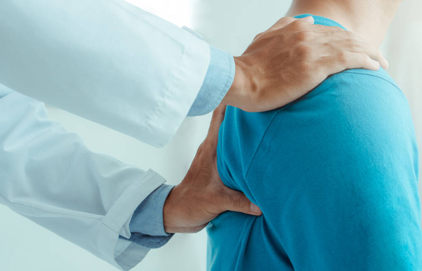 Physiotherapist working with patient in hospital.Physical therapy concept - Photo, Image