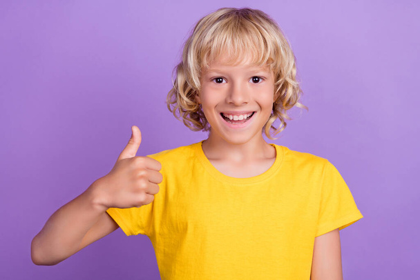 Photo of young cheerful positive happy boy smile make thumb up smile isolated on purple color background - Zdjęcie, obraz