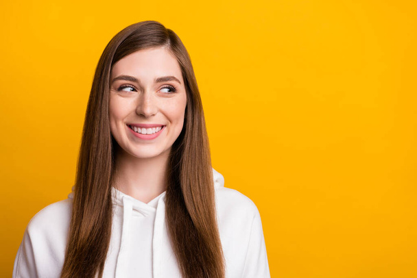 Photo of young dreamy happy positive woman look empty space good mood imagine isolated on yellow color background - Zdjęcie, obraz