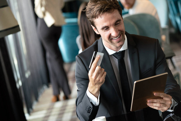 Portrait of happy successful businessman holding tablet. Technology, online shopping, business concept - Фото, зображення