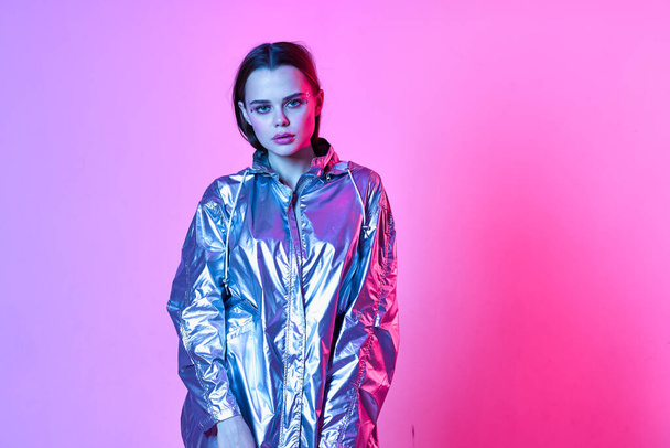 pretty woman in silver jacket makeup disco nightclub neon - Foto, Bild