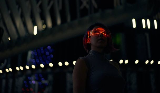 Cyberpunk style portrait of beautiful young woman in futuristic costume. - Photo, Image
