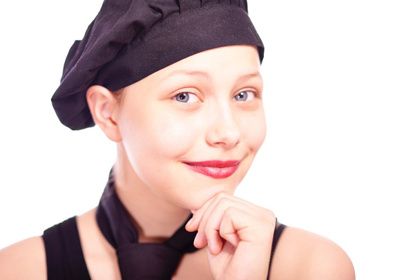 Teen girl dressed in chef hat - Fotó, kép