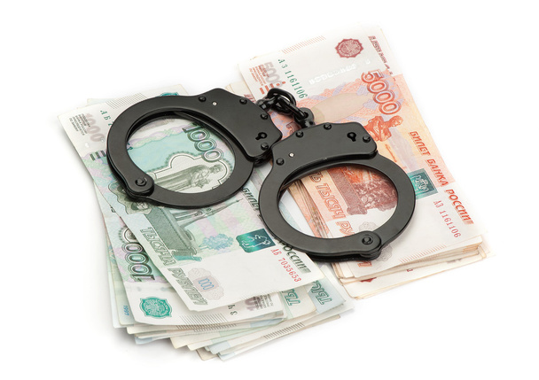 Handcuffs on Russian money - 写真・画像