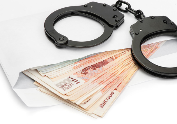 Handcuffs on Russian money - Foto, Imagen