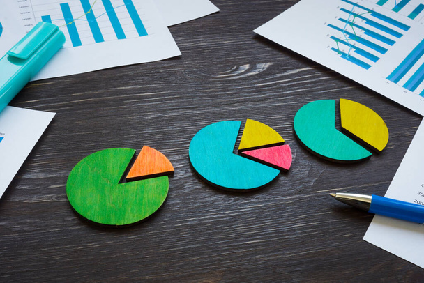 Pie charts on the table as a business or marketing analysis. - Photo, image