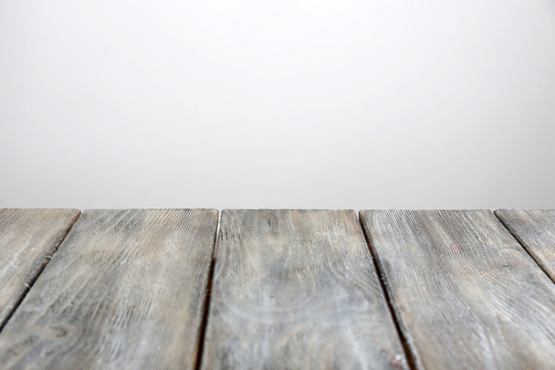 Rustic wooden board on grey background - Foto, afbeelding