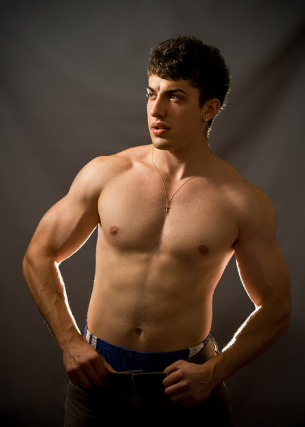 Portrait of sexy and muscular young man - Photo, Image