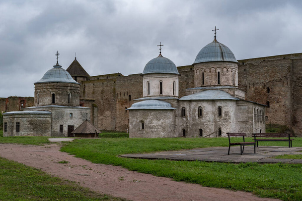 Ancient Church of Saint Nicholas and Church of Dormition of the Mother of God on territory of Ivangorod Fortress that was built in 1492. Ivangorod, Russia - Fotoğraf, Görsel