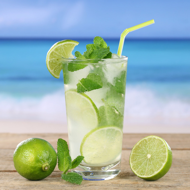 Mojito or Caipirinha cocktail drink on the beach - Фото, изображение