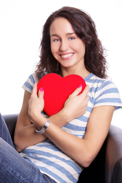 Young woman holding a heart  - Valokuva, kuva