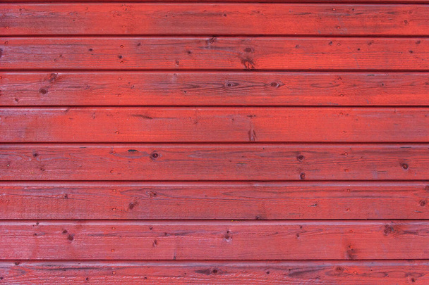 A red painted wooden spotted background - Photo, image