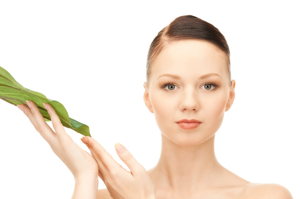 Woman with green leaf - Фото, изображение
