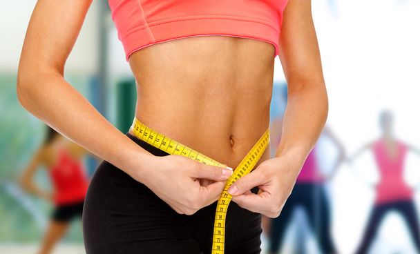 Happy Slim Woman Measuring Her Waist Stock Photo, Picture and Royalty Free  Image. Image 18846720.