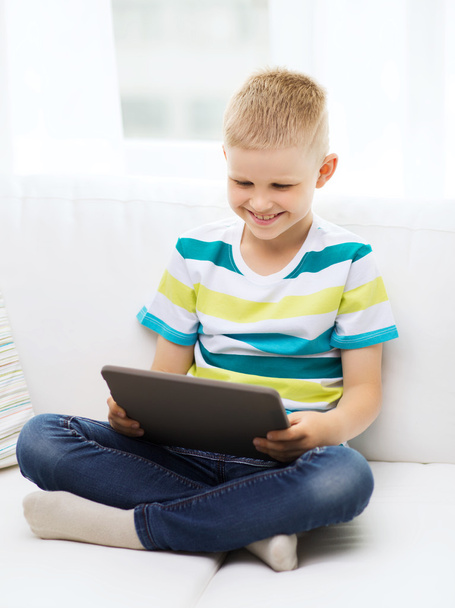 smiling boy with tablet computer at home - Fotoğraf, Görsel