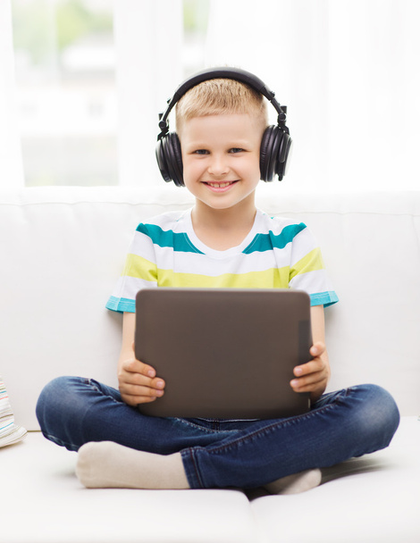 little boy with tablet pc and headphones at home - Φωτογραφία, εικόνα