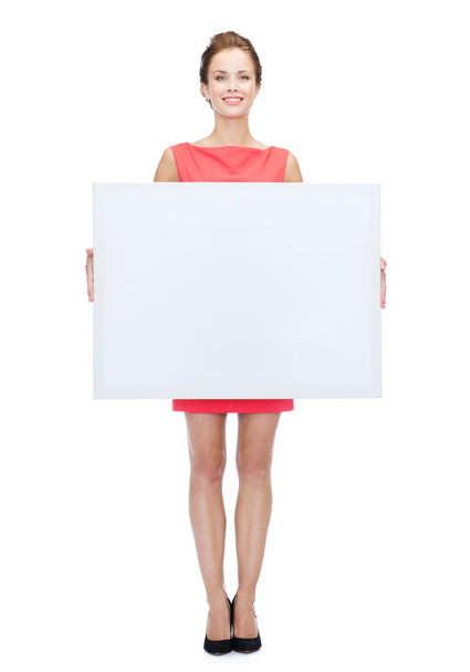 smiling young woman with blank white board - Fotografie, Obrázek