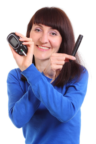 Smiling woman with glucose meter on white background - Foto, afbeelding