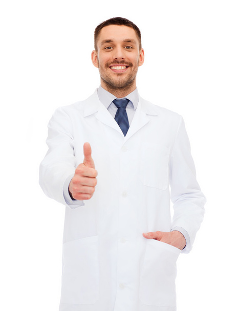 smiling male doctor showing thumbs up - Fotografie, Obrázek