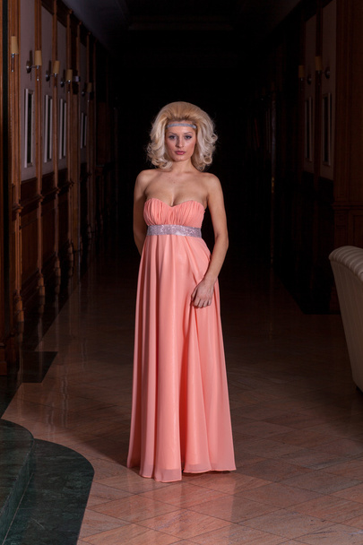 Beautiful blonde fashion model walking - long dress. - Photo, image