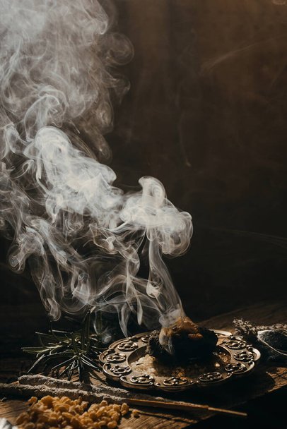 Charcoal burning with incense, incense resin, rosemary, - Foto, Bild