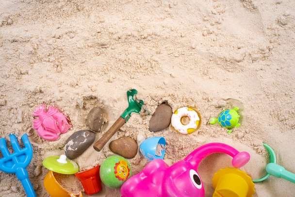 A top view of beach toys on the sand - Fotoğraf, Görsel