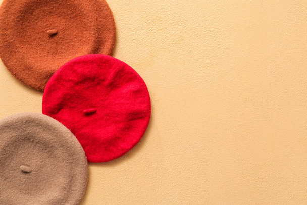 Different berets on color background - Photo, Image