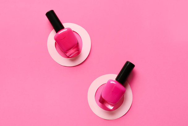 Bright nail polishes on color background - Foto, imagen