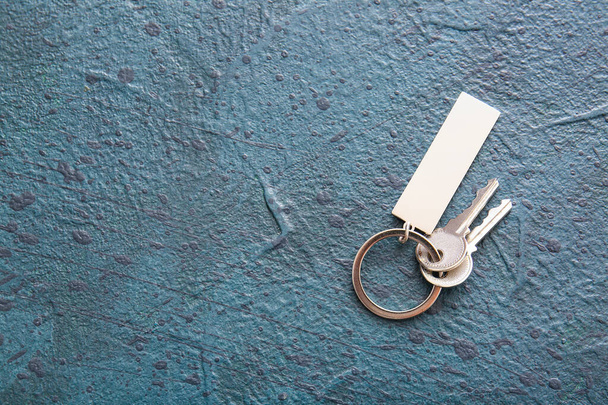 Keys with stylish keychain on dark background - Photo, Image