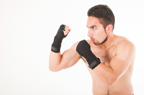 muscular martial arts fighter attacking - Фото, зображення