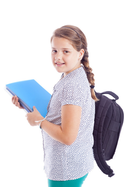 Portrait of a smiling school girl with backpack holding notebook - Foto, Bild
