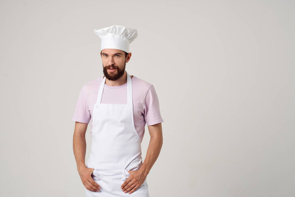 male chef with a hat on his head cooking profession job service - Foto, Imagem