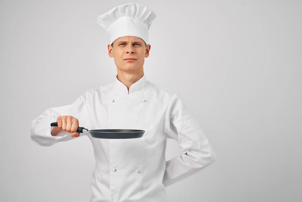 chef with a frying pan in hand kitchen service staff - Photo, Image