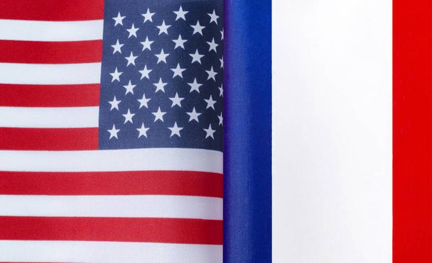 fragments of the national flags of the USA and France in close-up - Фото, зображення