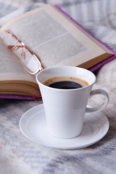 Cup of coffee on plaid - Фото, зображення