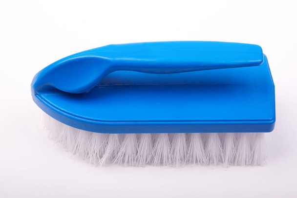 blue plastic brush for cleaning surfaces on a white background - Фото, зображення