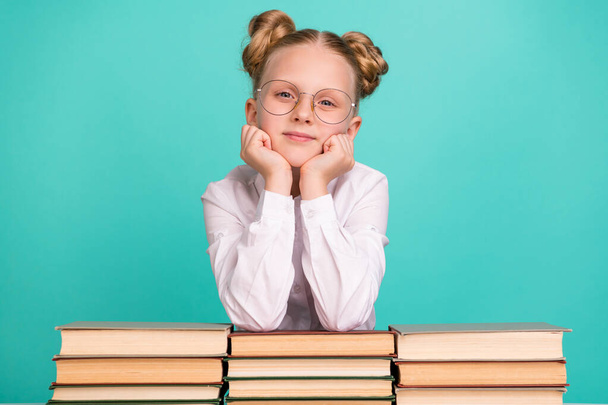 Photo of think small girl with books wear white shirt spectacles isolated on teal background - Zdjęcie, obraz