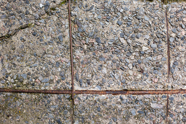 Old concrete slab with iron reinforcement as texture and background for design - Zdjęcie, obraz