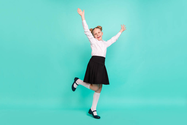Full body photo of cool small girl dance wear white shirt skirt socks shoes isolated on teal background - Foto, imagen