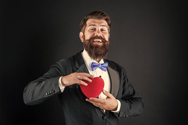 happy tuxedo man with beard hold romantic love heart, happy valentines day - Foto, Bild